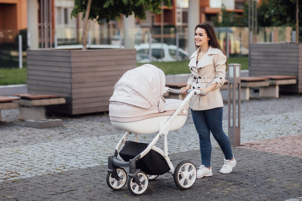 A mother folding a stroller during travel in the USA